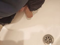 Teen in gloves pisses in the sink