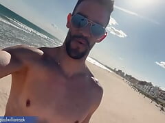 Sexy latin man naked on public beach